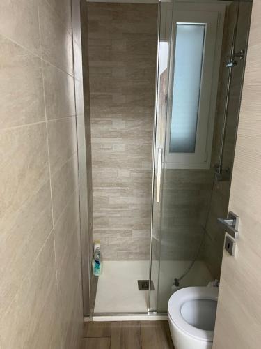 a bathroom with a shower with a toilet and a sink at Forte dei marmi casa vacanza in Forte dei Marmi
