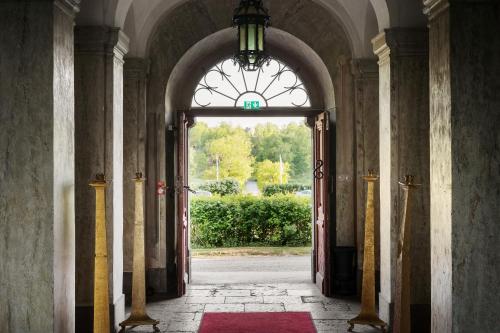 an entrance to a building with an open door at Husby Säteri in Söderköping