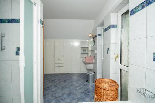 a bathroom with a toilet and a sink at Levendula Villa in Balatonőszöd