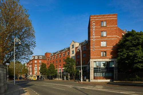 a red brick building on a city street at Leonardo Hotel Dublin Christchurch in Dublin