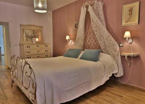 Ένα ή περισσότερα κρεβάτια σε δωμάτιο στο La Casa di Livia