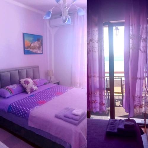 a bedroom with a bed and a window with curtains at Guest House Cinderella in Herceg-Novi
