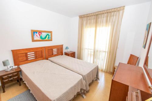 a bedroom with two beds and a window at Apartment Mountain View in Torrox