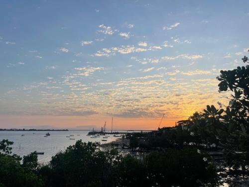a view of a harbor with boats in the water at Shimoni Reef Lodge in Shimoni