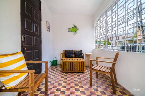 a room with two chairs and a large window at SAN JUAN Villa - Laplacita in San Juan