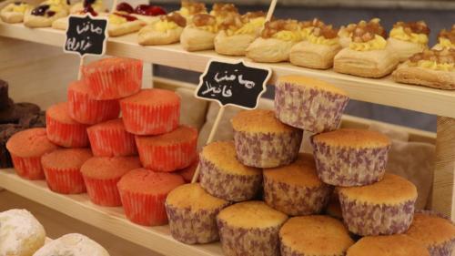 a display of different types of pastries in a bakery at Sandy palace Hotel in Amman