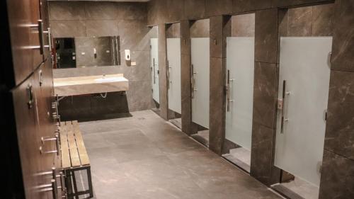 a bathroom with a sink and a mirror at Sandy palace Hotel in Amman