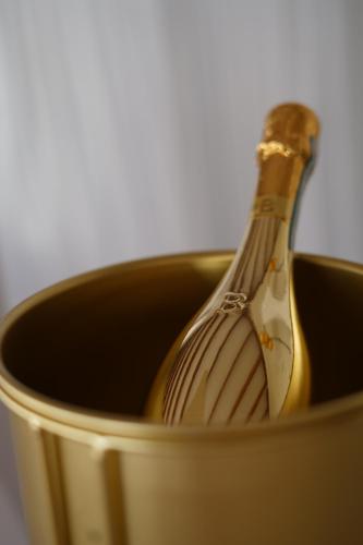 a close up of a champagne bottle in a can at Hôtel Village Pomme Cannelle 3 étoiles in Le Prêcheur