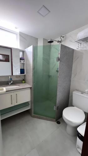 a bathroom with a shower and a toilet and a sink at Flat Fabuloso 808 Villa Hípica in Gravatá