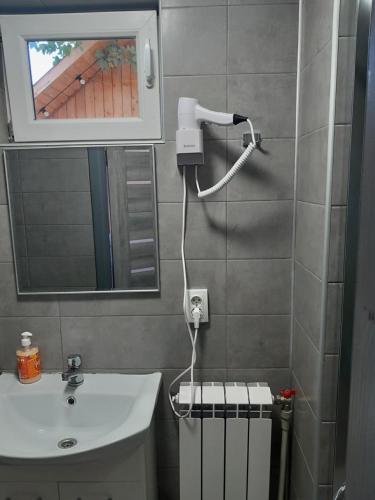 a bathroom with a sink and a mirror at Кукул in Vorokhta