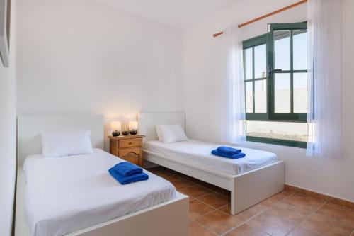 Giường trong phòng chung tại Vista de la Montaña