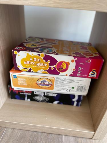 two boxes of mickey mouse cookies in a drawer at AM3Office apartment Lausanne new, cozy, central, fast Wi-Fi & contactless check-in in Prilly