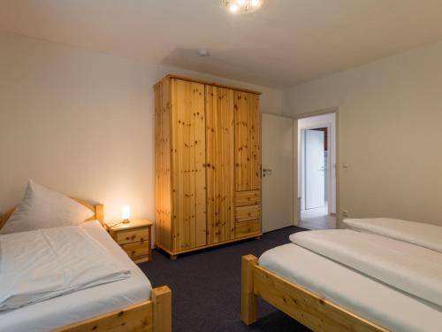 Ένα ή περισσότερα κρεβάτια σε δωμάτιο στο Apartment Eifelnatur - Haus 2-3 by Interhome