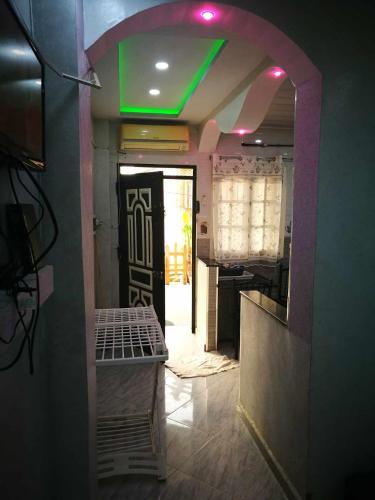 a hallway with a green light in a room at STUDIO Jijel in Jijel