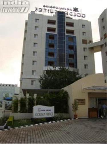 a large building with a sign in front of it at Royal Orchid Golden Suites Pune in Pune