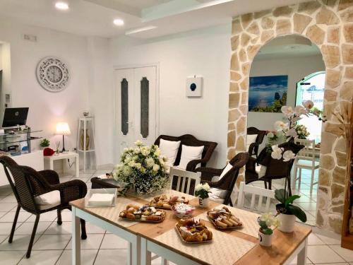 a living room with a table with food on it at Villa Miriam in Gragnano