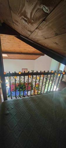 a balcony with a wooden railing in a building at Le gîte des Roussels in Rousses