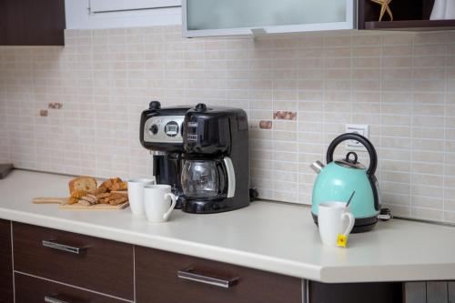 a coffee maker on a counter in a kitchen at Starfish House - Close to the Beach in Goúdhouros