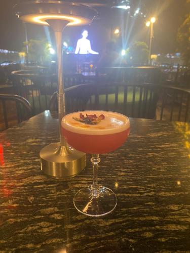 a drink sitting on top of a table at Victor Gallery hotel & spa - Victor Group in Hanoi