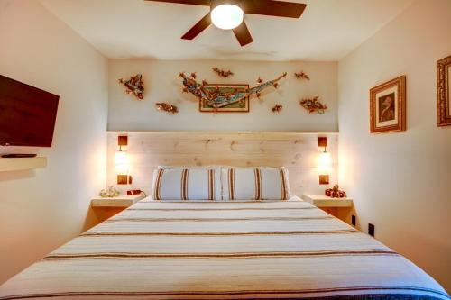 a bedroom with a bed and a ceiling fan at Topsail Dunes 1213 - BLDG 1 in North Topsail Beach