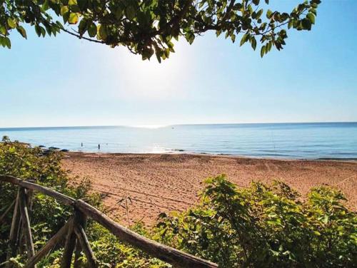 a view of a beach with the ocean in the background at B&B Capo Rizzuto Armenes in Capo Rizzuto