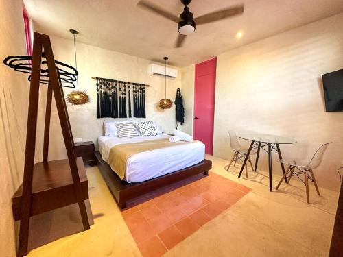 En eller flere senge i et værelse på Room Cuzama disfruta de este paraiso