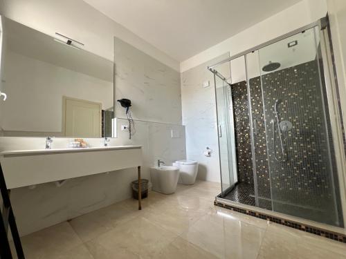a bathroom with a shower and a sink at DubaiBeachotel in Lido degli Estensi