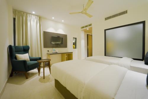 Ένα ή περισσότερα κρεβάτια σε δωμάτιο στο Pride Inn