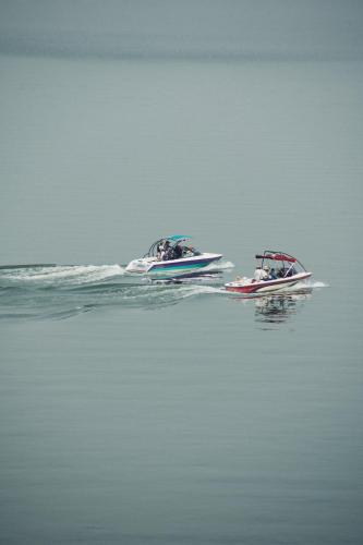 two boats floating on the water in the water at Hotel Master Club in Tequesquitengo