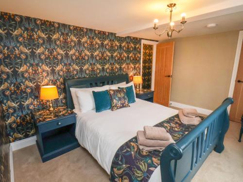 Ένα ή περισσότερα κρεβάτια σε δωμάτιο στο Seascape Cottage