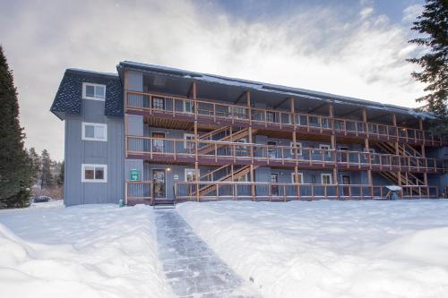 a large building with snow in front of it at Hi Country Haus Unit 1803 in Winter Park