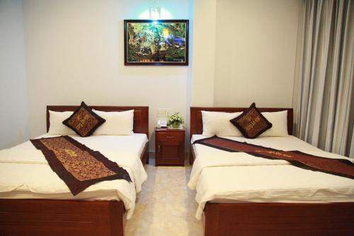 Katil atau katil-katil dalam bilik di Tan Truong Son Hotel