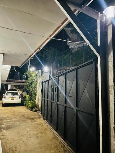 a garage door with a car parked in front of it at O2 Bandarawela in Bandarawela
