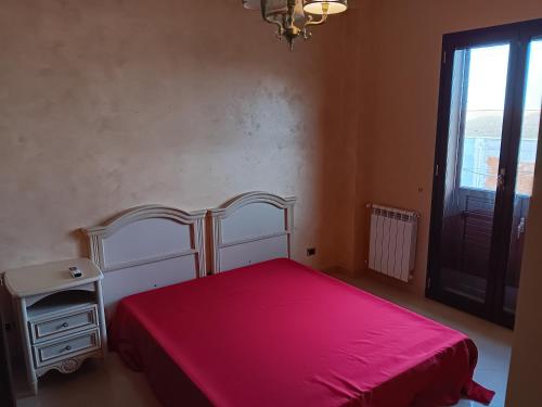 Ένα ή περισσότερα κρεβάτια σε δωμάτιο στο Casa Adelaide