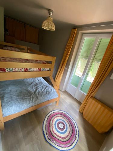 a bedroom with a bunk bed and a window at Villa Rosemarie in Valdeblore
