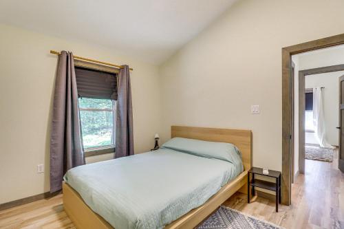 a bedroom with a bed and a window at Pool and Beach Access Charming Poconos Cabin! in Albrightsville