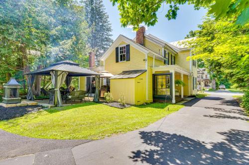 a yellow house with a gazebo in the yard at 6 Mi to Lake George Adirondack Home with Game Room in Warrensburg