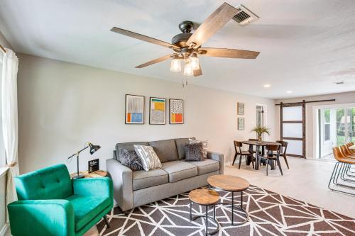 a living room with a couch and a ceiling fan at Walk to Lewisville Lake Dog-Friendly Texas Home in Little Elm