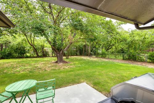a patio with a table and a grill and a tree at Walk to Lewisville Lake Dog-Friendly Texas Home in Little Elm