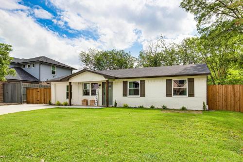a white house with a fence and a yard at Walk to Lewisville Lake Dog-Friendly Texas Home in Little Elm