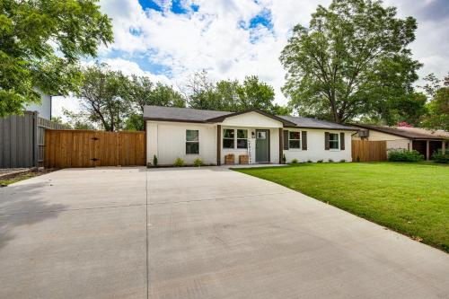 a house with a driveway in front of a fence at Walk to Lewisville Lake Dog-Friendly Texas Home in Little Elm