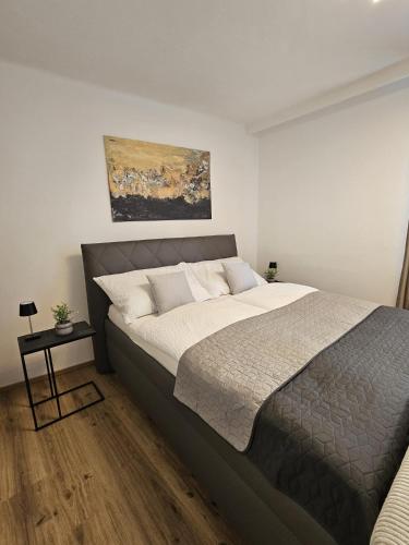 Postel nebo postele na pokoji v ubytování Stadtoase Wels II