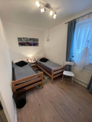 Postel nebo postele na pokoji v ubytování Ferienwohnung am Seeblick
