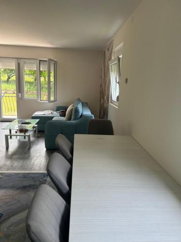 a living room with a couch and a table at Kosmaj Ruža vetrova in Sopot
