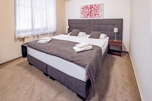 Postel nebo postele na pokoji v ubytování Relax Hotel Stork