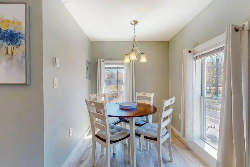 a dining room with a table and chairs and a window at Cozy Waterfall BnB - Close To Mountains and Hikes in East Durham