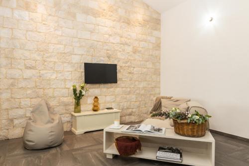 Μια τηλεόραση ή/και κέντρο ψυχαγωγίας στο Loft Rooms I Cinque Mori