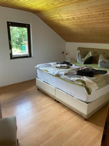 Ένα ή περισσότερα κρεβάτια σε δωμάτιο στο Ferienhaus Mausberg