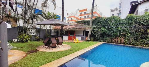Πισίνα στο ή κοντά στο POUSADA VILLA DI GUARUJÁ
