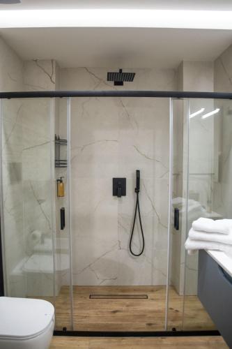 a shower with a glass door in a bathroom at AMarescaladeiturchy Valle dei templi in Realmonte
